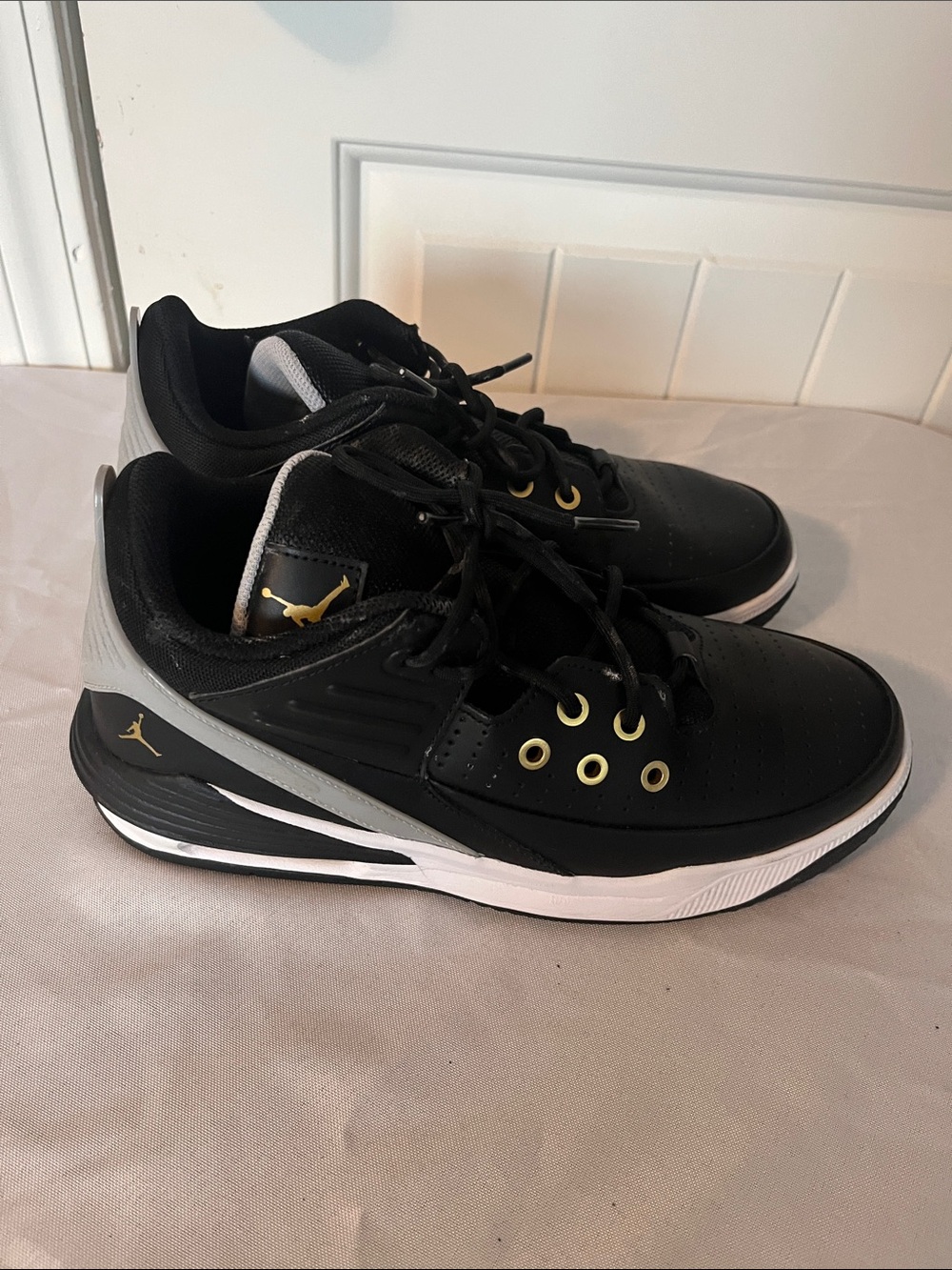 Jordan Men's Black Athletic Low-Top Sneakers with Gold Accents